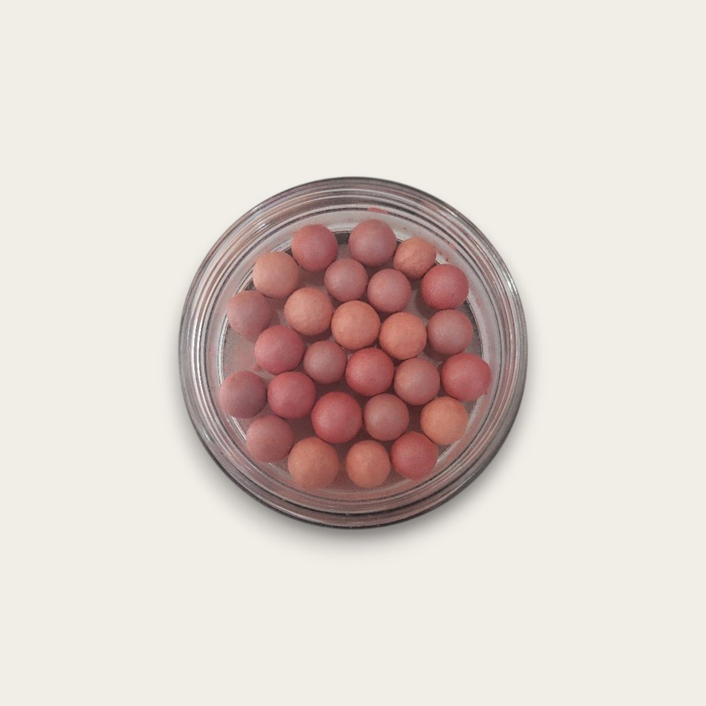 Perlas bronceadoras tono pétalos